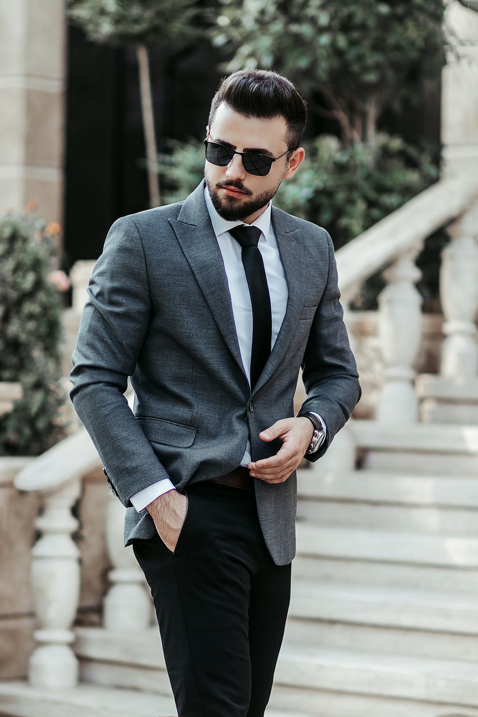 Man in a charcoal grey wool jacket with black trousers