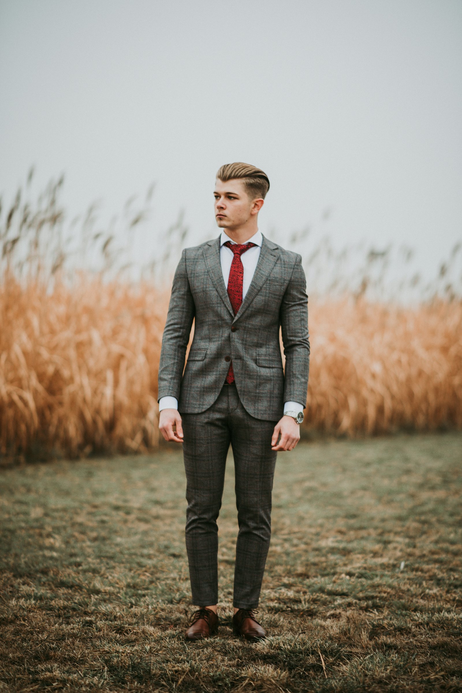 Man in a grey windowpane-check wool suit