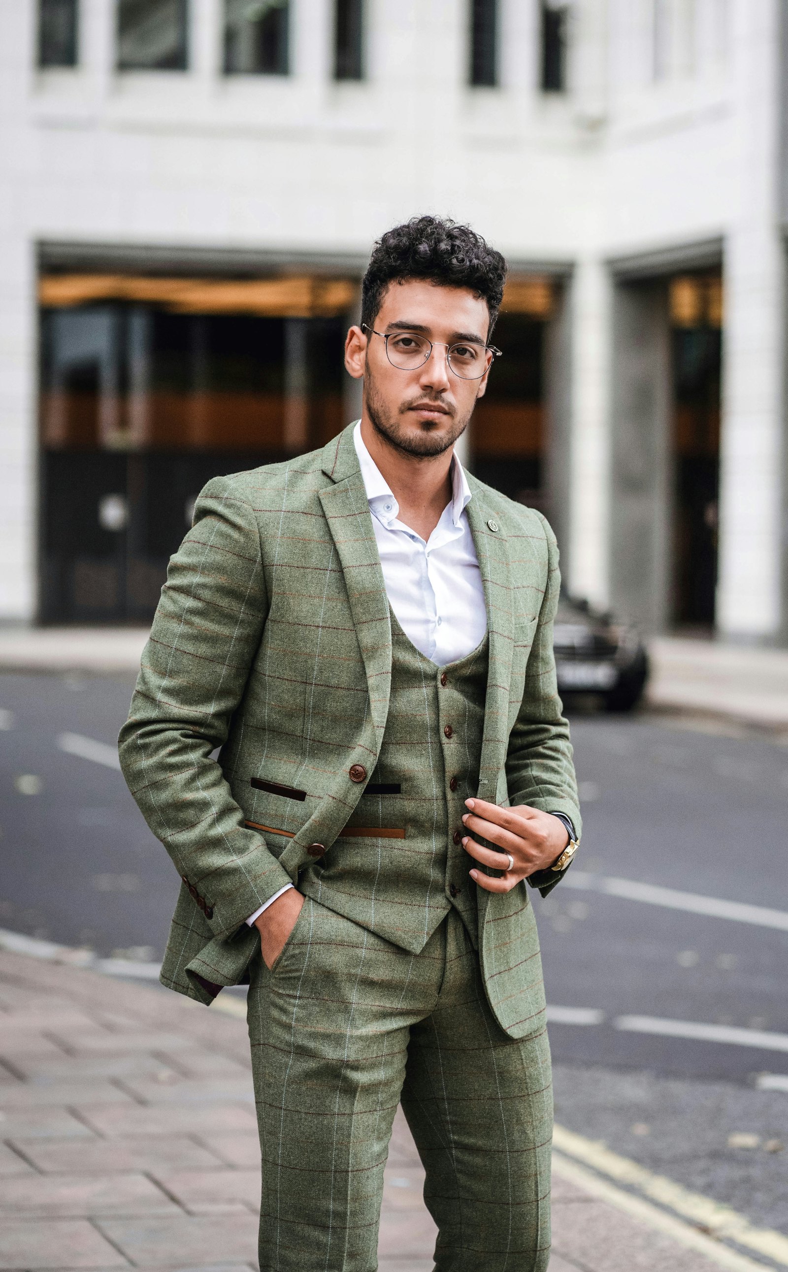 Man in a green checked tweed three-piece suit