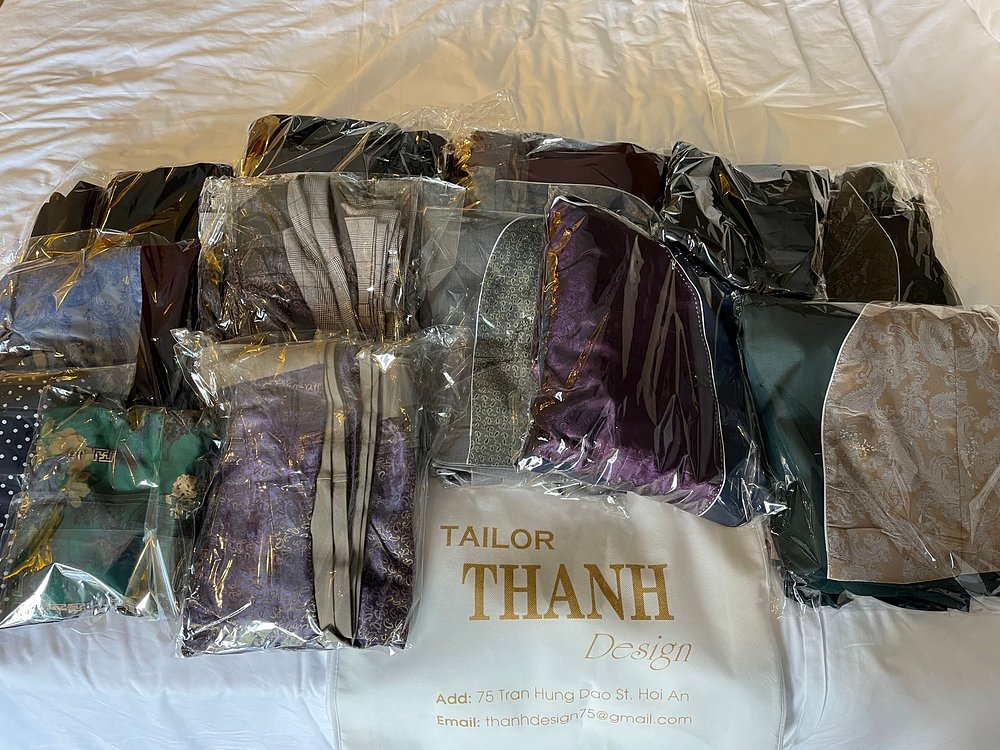 A full custom order packed in labeled THANH Design tailor bags, ready to travel